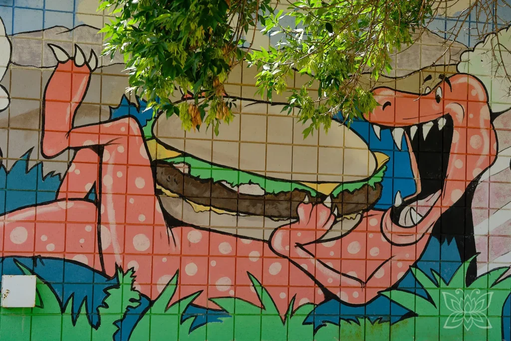 Dino auf einem Wandgemälde